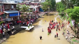 Indonesians celebrate Independence Day on river for first since since pandemic began