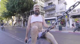 Man wears HILARIOUS costumes while riding skateboard in Israel