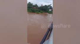 Stranded pensioner survives after pontoon overturns in raging flood in Thailand