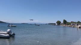 Plane makes dangerously low landing above people's heads in Greece