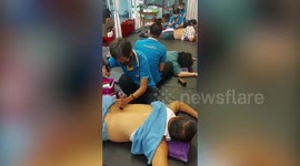 Unusual traditional Thai massage uses hammer and wood to ease customers' body pain