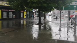 A torrential downpour of rain hits Gants Hill In East London