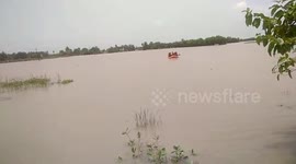 Stranded people rescued from middle of river in eastern India