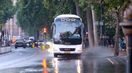 Vehicles forced to drive through deep surface water after earlier deluge on Victoria Embankment