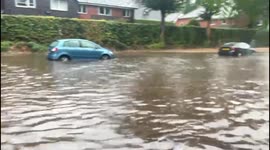 Abandoned Cars and Drivers Risking the Drive Through- Extreme Flooding on the B197 in Oaklands, Welwyn Hertfordshire UK