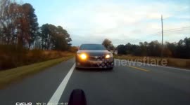 BAD CRASH WARNING. Dangerous car driver runs over cyclist. Car hits cyclist.