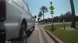 Truck close passes cyclist. Truck drives dangerous close to a cyclists. Dangerous driving caught on camera