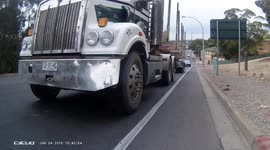 Truck passes cyclists incredibly close. Truck close passes cyclist. Dangerous driving caught on camera