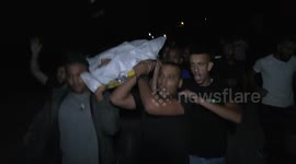 Mourners carry the body of Palestinian Wassim Khalifa, 19, killed by Israeli security forces during his funeral