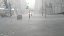 Thick rain in London after flood alerts are issued