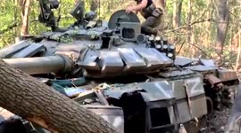 Ukrainian soldiers discover damaged Russian T72-B3 tank in forest and claim it as trophy