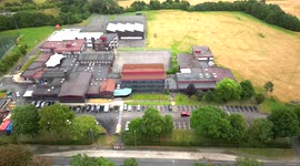 Aerial footage of A Level Results students arrive at school college to receive their results.