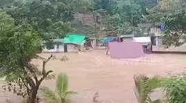 Three-storey house under construction washed away by flood in Myanmar