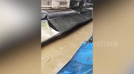 Market stalls near Thai-Myanmar river border submerged in flash flood in Myanmar