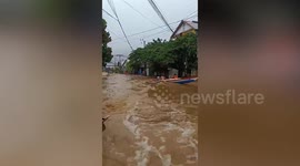 Residents ride boats to escape surging floods in Myanmar