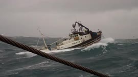 Ship in Storm - Fishing trawler tossed around in rough seas