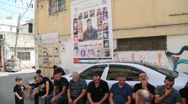 The family of Palestinian Wassim Khalifa killed by Israeli security forces mourn during his funeral
