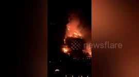 Locals watch on as huge mountain fire breaks out in southern China