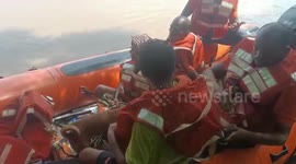 Father and son stranded for days dramatically rescued in east Indian river