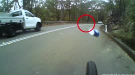 Bogan cup throw. Ute throws cup at cyclist on the road. Dangerous driving caught on camera