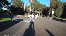 Car cuts off cyclist. Car crashes into cyclist. Dangerous driving caught on camera
