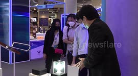 Delighted students play with inventions at fun science fair in Bangkok