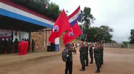 Militia salute flag during celebration of the Karenni Army Day in Myanmar