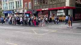 Commuters wait for buses at Liverpool Street station as tube strike hits London