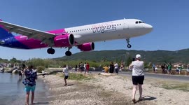Plane makes dangerously low landing above people's heads in Greece