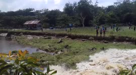 Tidal bore hits village in Indonesia - filmed from a tree in the middle of it (Part 3)