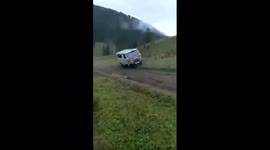 Minibus powers up hill in Altai, Russia, then loses control and careers downhill at speed