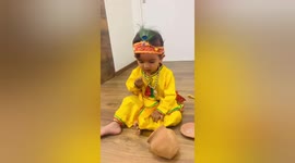 A Indian family has decorated a one year child made looks small Krishna