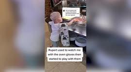 Meet the little boy who doesn't care for teddy bears or toys but has become attached to his mum's OVEN GLOVES