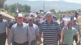 Palestinians take part in a demonstration against settlements in the village of Beit Dajan