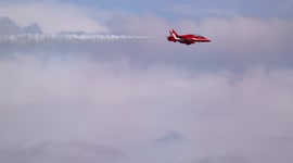The Red Arrows perform a spectacular close pass during Eastbourne Air show, slow motion footage