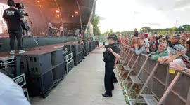 Two police officers dance along to Scouting For Girls at Camp Bestival, Shropshire. Friday