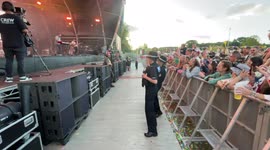 Police officers dance at Scouting For Girls set at Camp Bestival in Shropshire, England