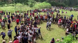 Men gather for rituals called Sisemba traditional kicking, which is actually a mass kick fighting during celebrating the harvest season in North Toraja of South Sulawesi, Indonesia, Aug. 20, 2022.