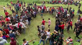 Men gather for rituals called Sisemba traditional kicking, which is actually a mass kick fighting during celebrating the harvest season in North Toraja of South Sulawesi, Indonesia, Aug. 20, 2022.