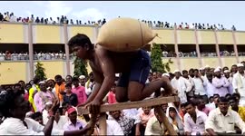 Giant rock-balancing squats among the unique weight-lifting challenges at South Indian festival