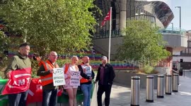 Rail workers begin strike on the picket line outside Birmingham New Street station.