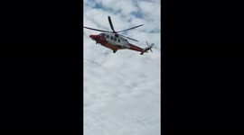 Rescue helicopter landing at Beachy Head, East Sussex