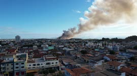 Smoke fills the sky as fire burns through vegetation in eastern Brazil