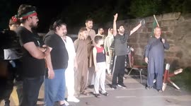 Imran Khan's supporters gather outside his house as former PM is charged under anti-terror laws