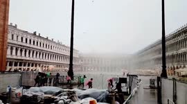 Italy: Visitors Frantically Take Cover As Sudden, Violent Gusts Rip Through Piazza San Marco In Venice