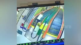 Worker stops escalator after seeing boy laying on handrail in China