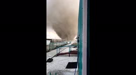 Tornado swirls debris into air as it rips through Crimea