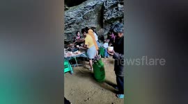 Villagers dine inside cool cave as heatwave scorches southern China