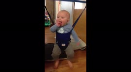 Boy Jumps in Bouncer