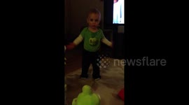 Boy Dances With Stuffed Animal